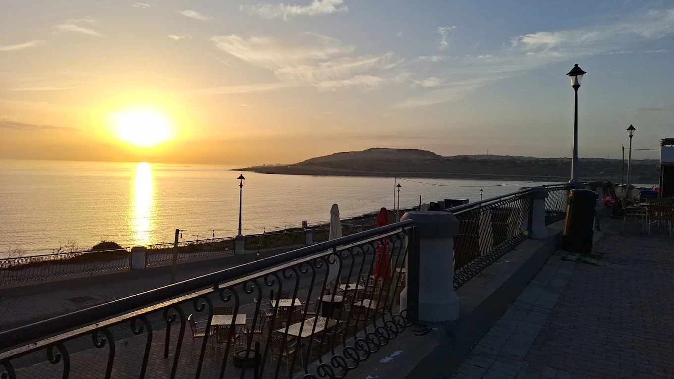 Mamma Carm Kiosk on the Qawra promenade at sunset